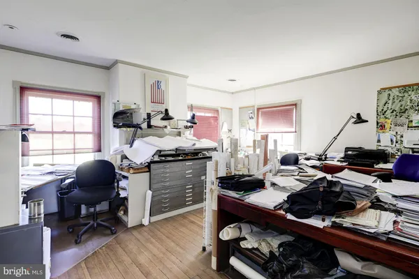 a front view of a house with basket ball court and garage