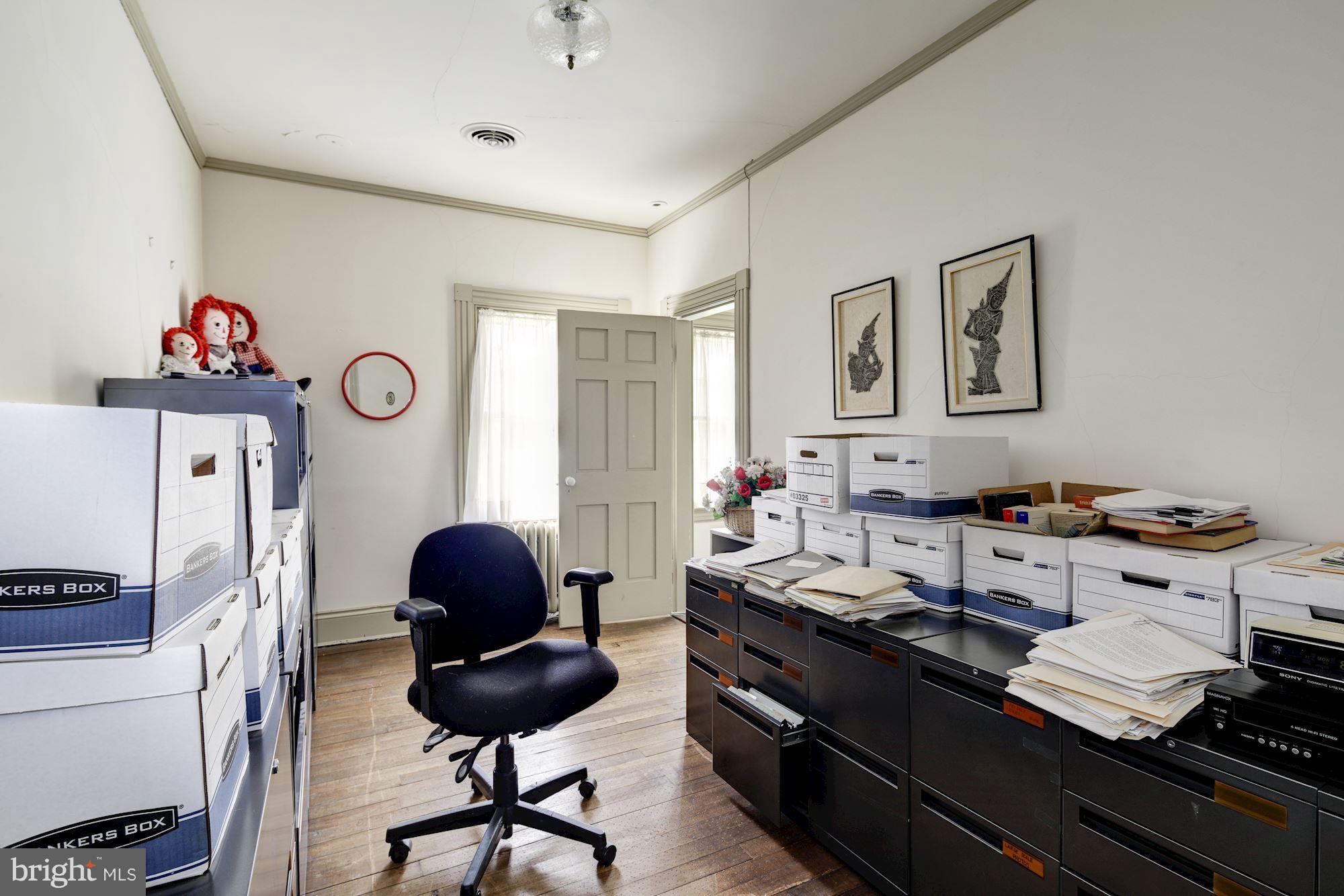 16449 Ed Warfield Road Woodbine, MD 21797 - Photo 50 of 102 a living room with furniture and a window