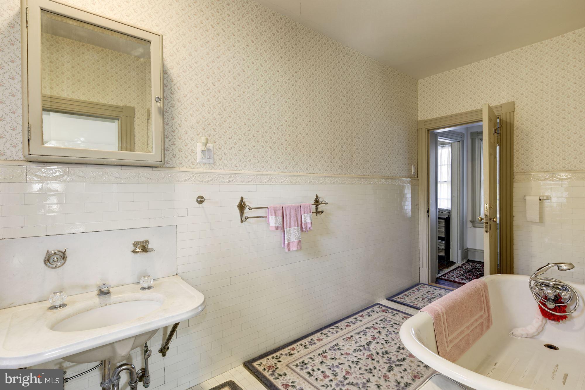 16449 Ed Warfield Road Woodbine, MD 21797 - Photo 53 of 102 a bathroom with a sink and a mirror