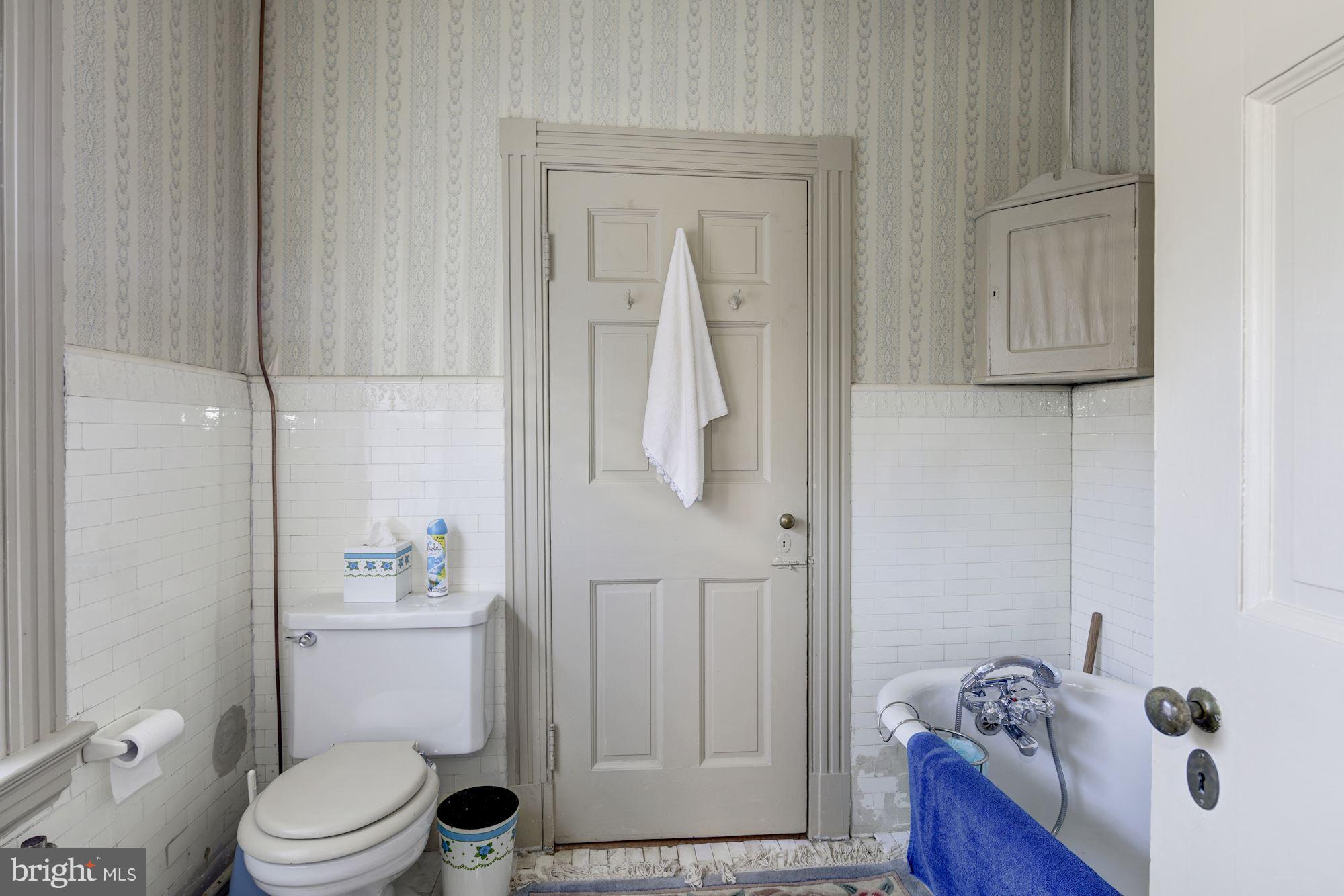 16449 Ed Warfield Road Woodbine, MD 21797 - Photo 54 of 102 a white toilet sitting next to a bathroom sink