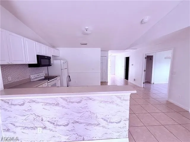 a view of a room with a sink and a window