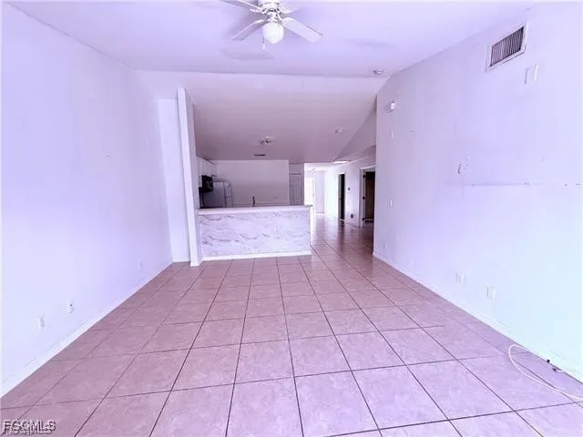 a view of a hallway with a chandelier