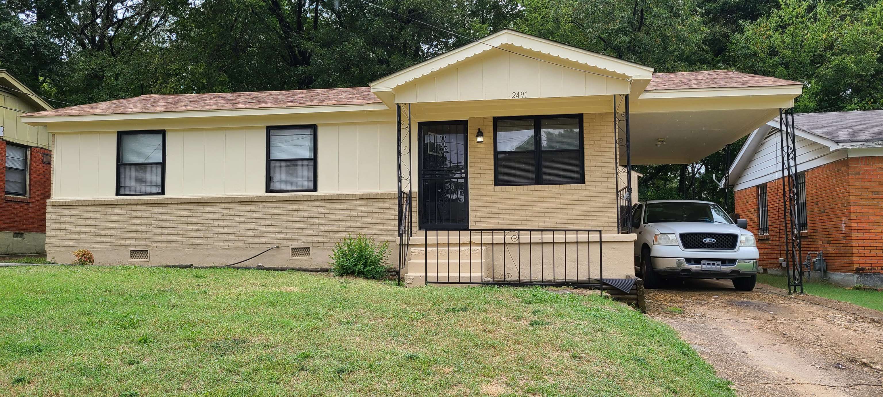 2491 Perry Road Memphis, TN 38106 - Photo 1 of 23 a view of a house with a yard