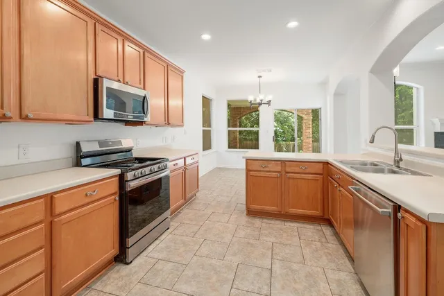 a view of an empty room with windows