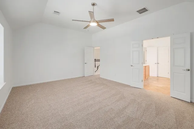 a spacious bathroom with a shower sink and mirror