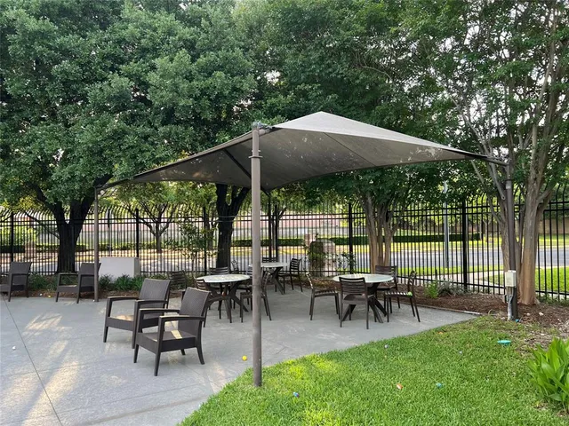 a view of a park with large trees
