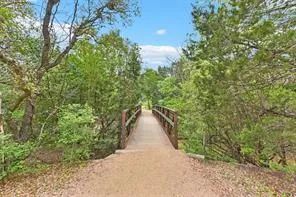 a view of a patio with a table and chairs under an umbrella