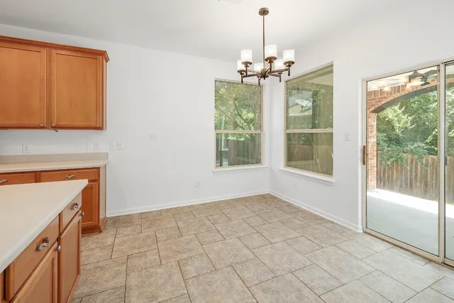 a view of a kitchen with a sink and a window