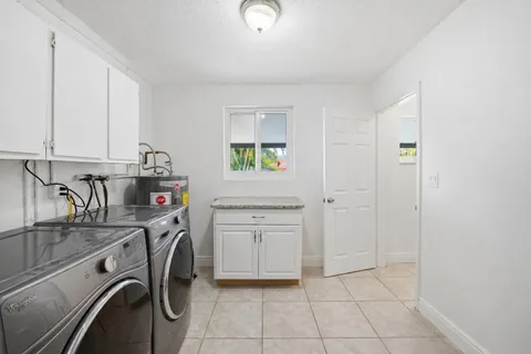 a view of kitchen sink and cabinets