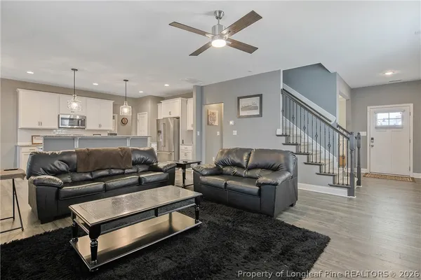 a living room with furniture and a fireplace