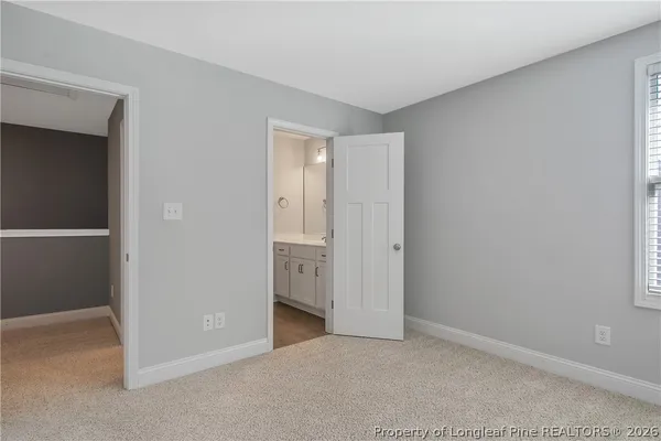 a bathroom with a double vanity sink and mirror