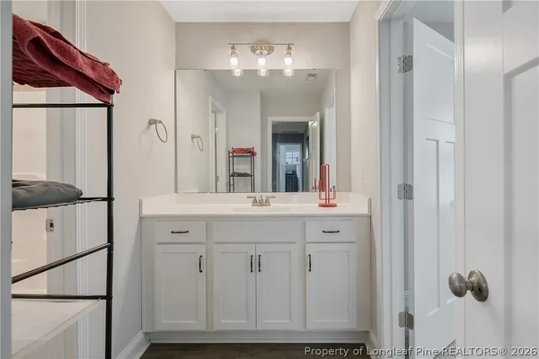 a bathroom with a sink and mirror
