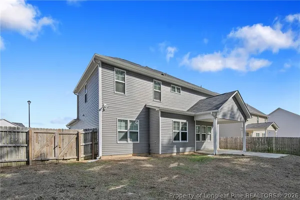 a view of a backyard with trees