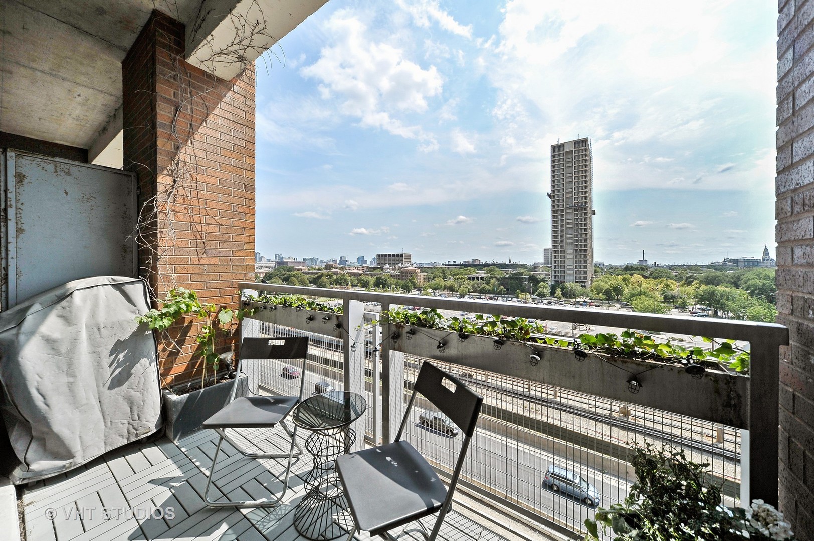 933 West Van Buren Street, Unit 612 Chicago, IL 60607 - Photo 14 of 17 a terrace with outdoor seating and city view
