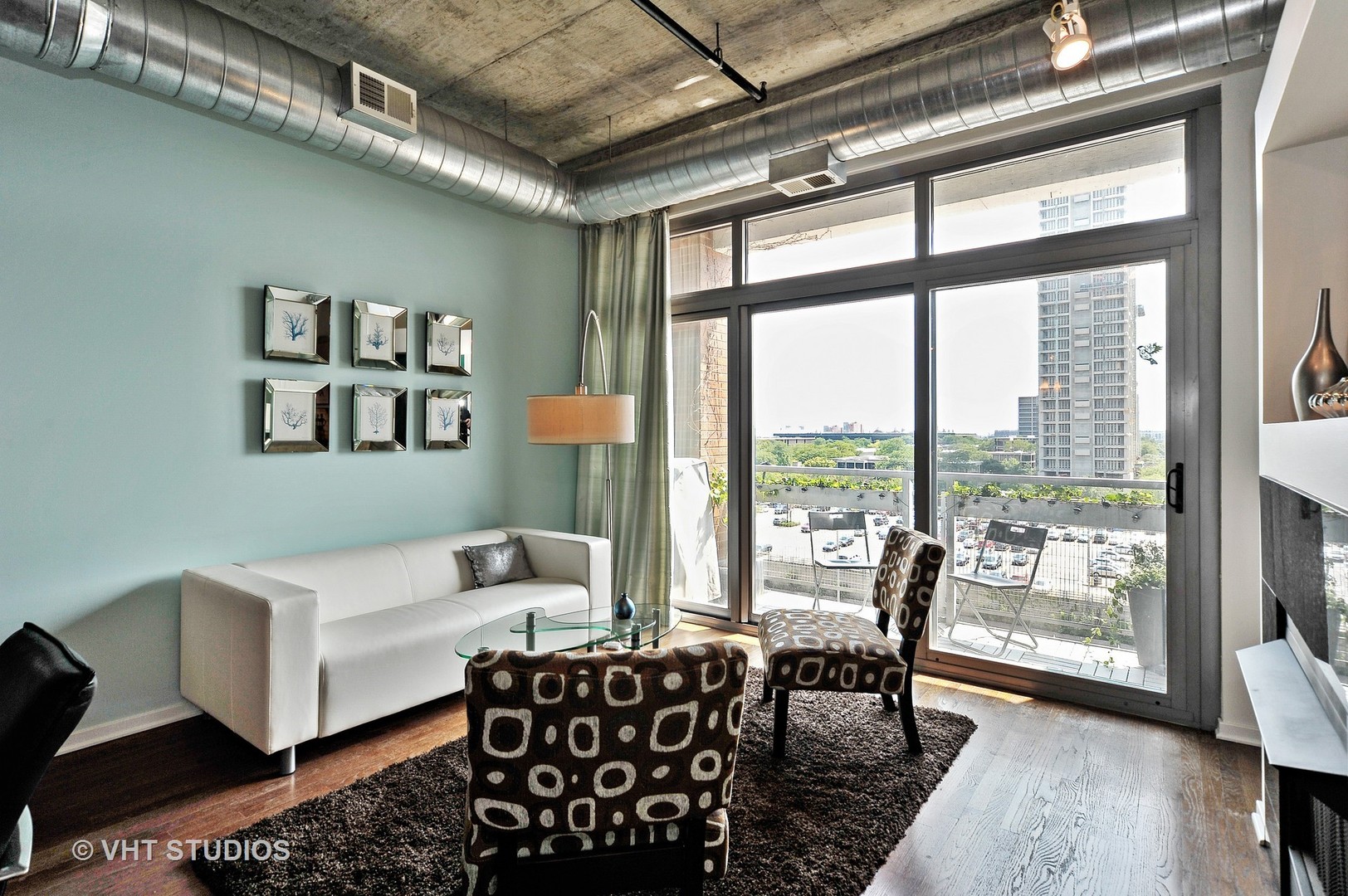 933 West Van Buren Street, Unit 612 Chicago, IL 60607 - Photo 3 of 17 a bedroom with furniture and a large window
