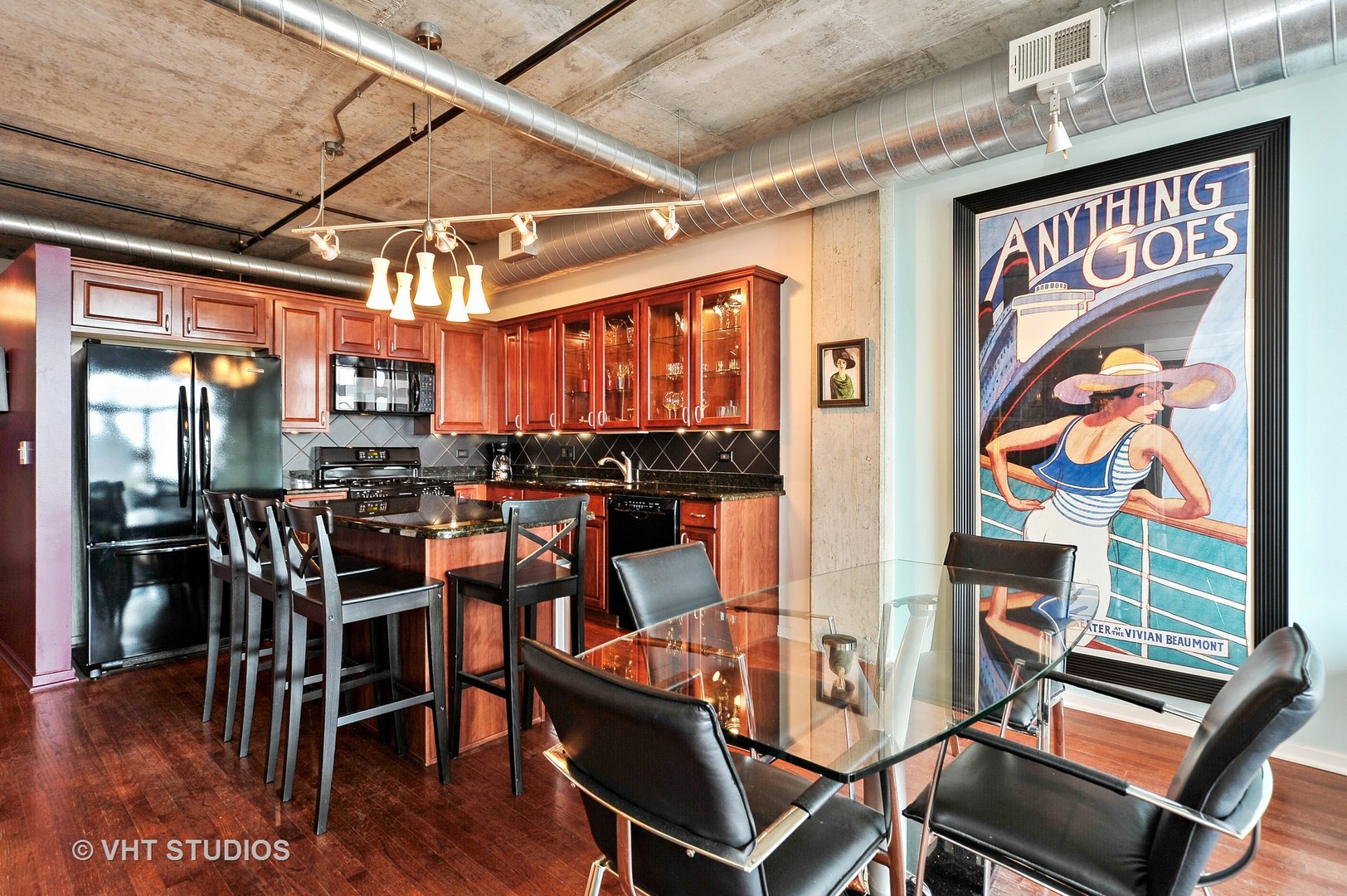 933 West Van Buren Street, Unit 612 Chicago, IL 60607 - Photo 5 of 17 a view of a dining room with furniture wooden floor and chandelier