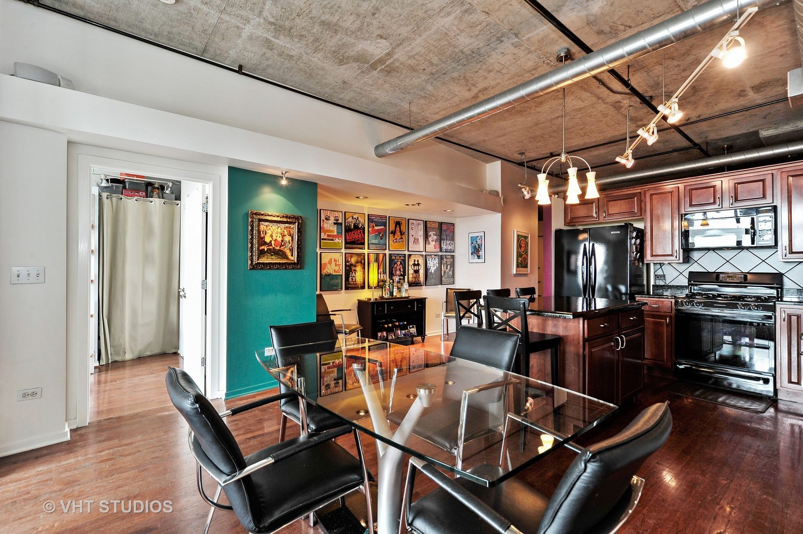 933 West Van Buren Street, Unit 612 Chicago, IL 60607 - Photo 6 of 17 a dining room with furniture and wooden floor