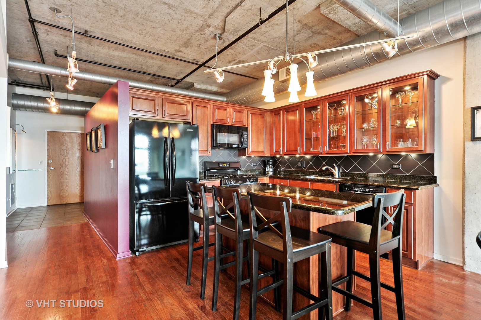 933 West Van Buren Street, Unit 612 Chicago, IL 60607 - Photo 8 of 17 a view of a dining room with furniture window and wooden floor