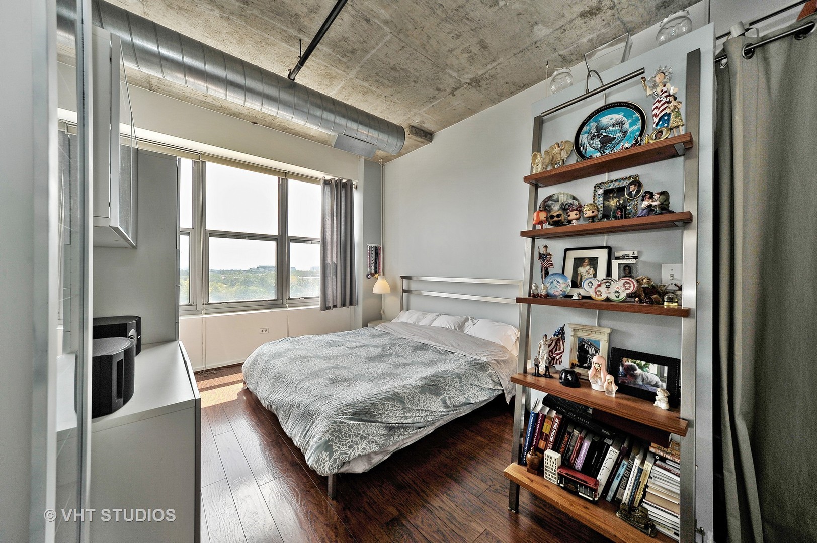933 West Van Buren Street, Unit 612 Chicago, IL 60607 - Photo 10 of 17 a bedroom with a bed and a window