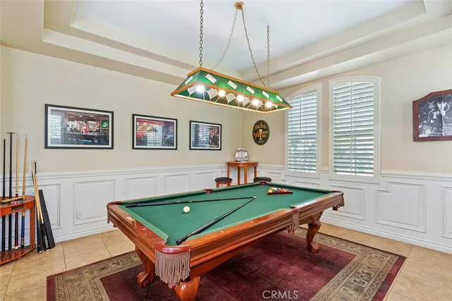 a bedroom with furniture and a large window