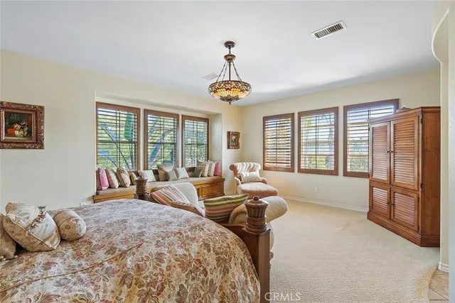 a bathroom with a sink vanity mirror and toilet