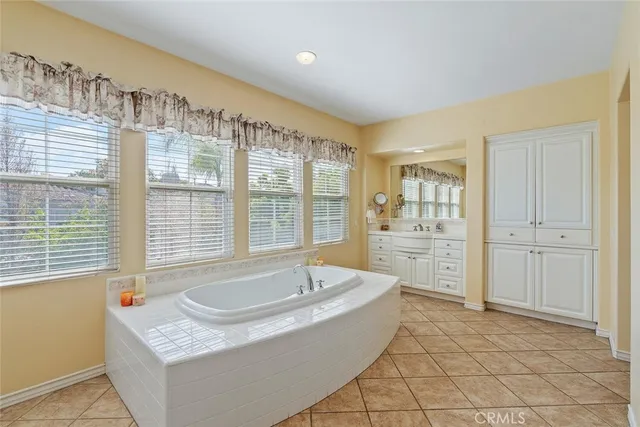 a bathroom with a sink a vanity and a mirror