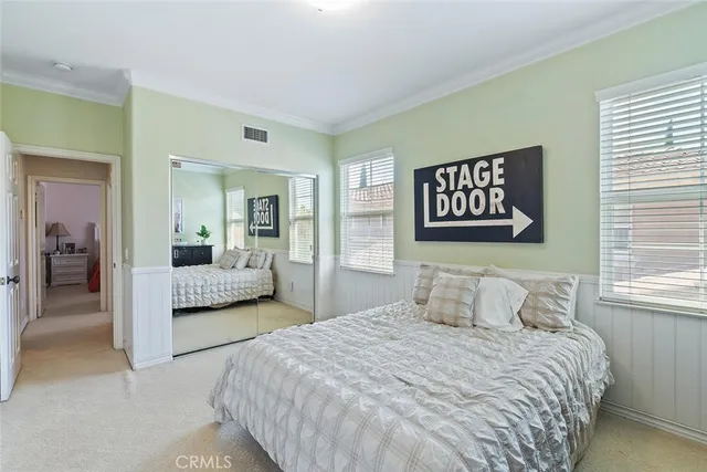 a front view of a house with garden and parking