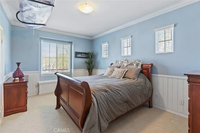 a view of a patio with table and chairs under an umbrella