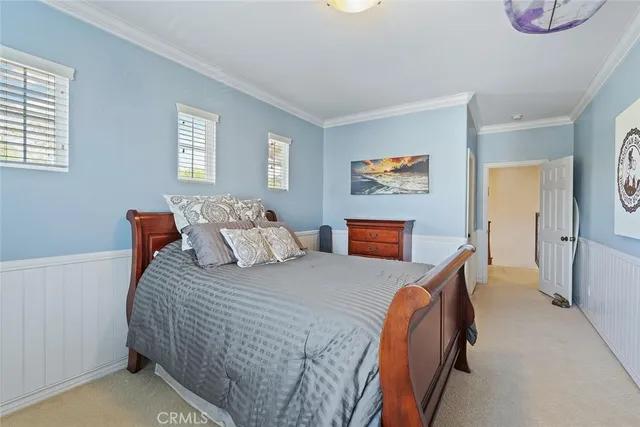 a view of a patio with a dining table and chairs under an umbrella