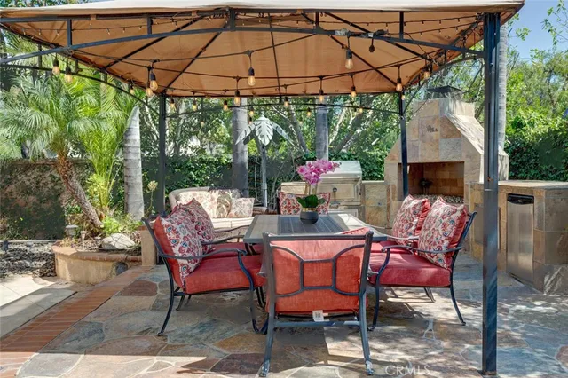 a view of empty room with wooden floor and fireplace