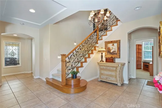 a kitchen with stainless steel appliances granite countertop a stove top oven a sink a refrigerator and a granite counter tops