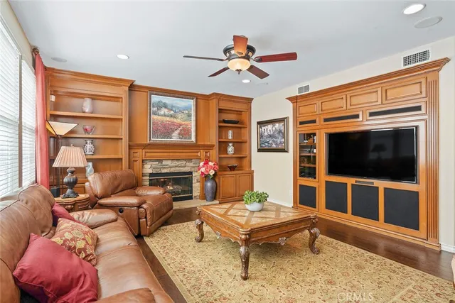 a kitchen with granite countertop stainless steel appliances a sink and cabinets