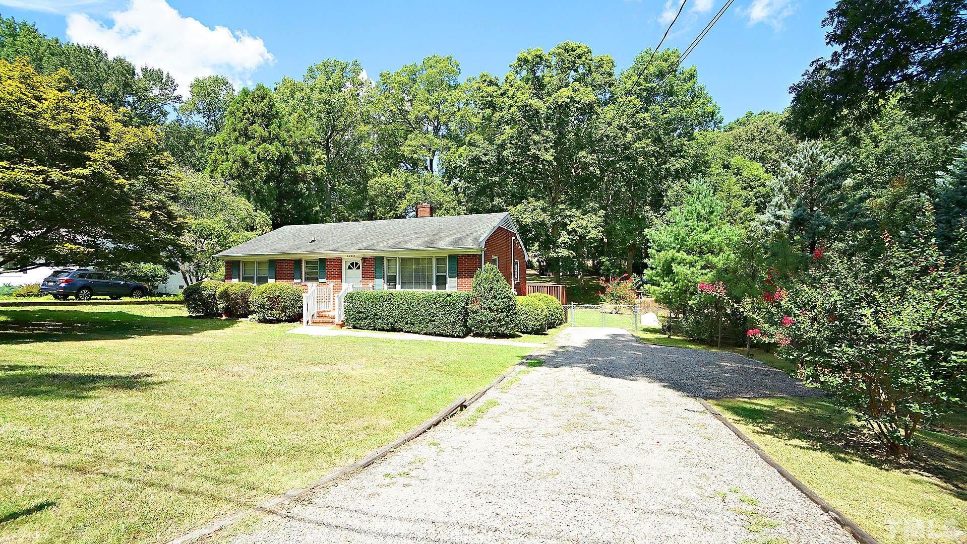 3609 Cranston Road Garner, NC 27529 - Photo 18 of 26 a front view of a house with a yard