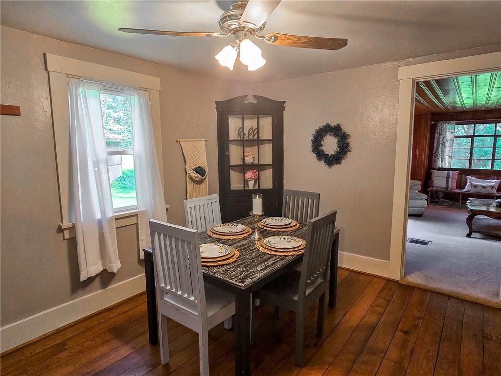 1638 Lake Road Mercer, PA 16137 - Photo 6 of 50 a view of a dining room with furniture window and wooden floor