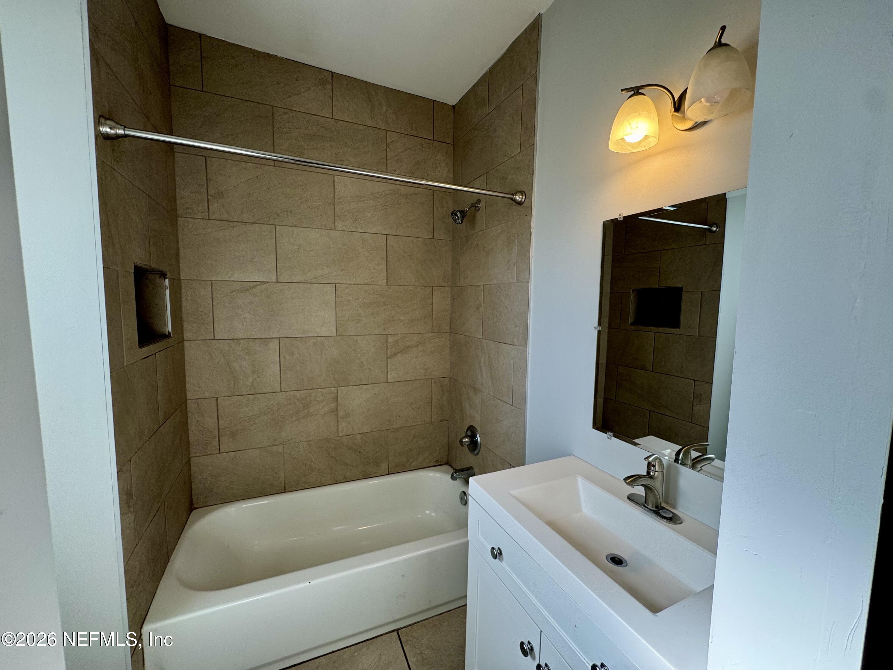 3032 Rayford Street Jacksonville, FL 32205 - Photo 10 of 17 a bathroom with a sink and a tub