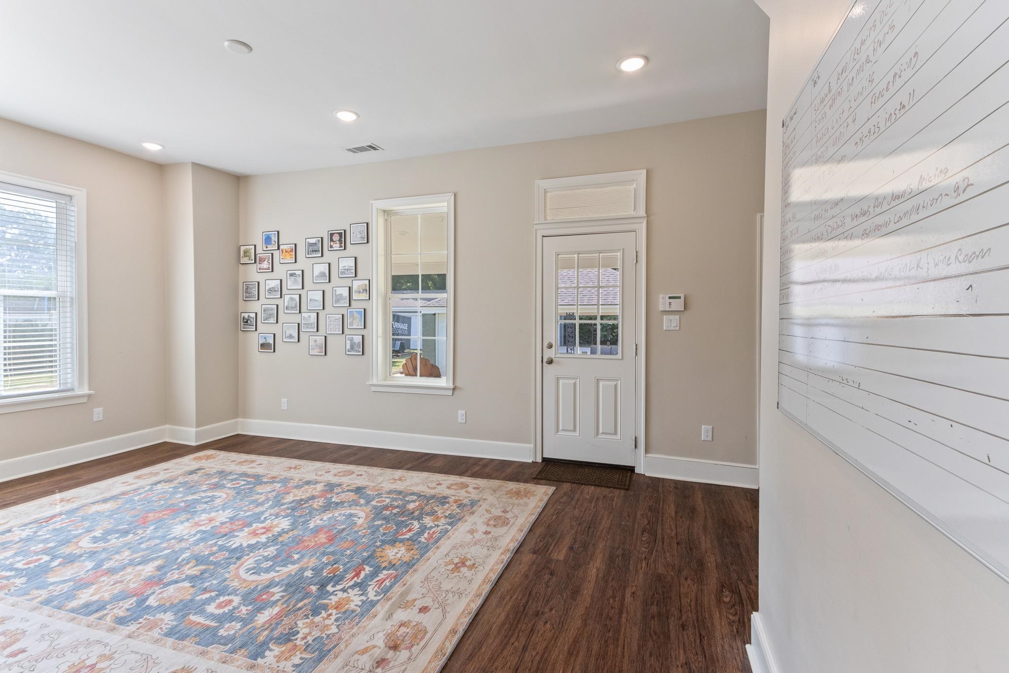 4775 Macon Road Memphis, TN 38122 - Photo 12 of 31 wooden floor in an empty room with a window
