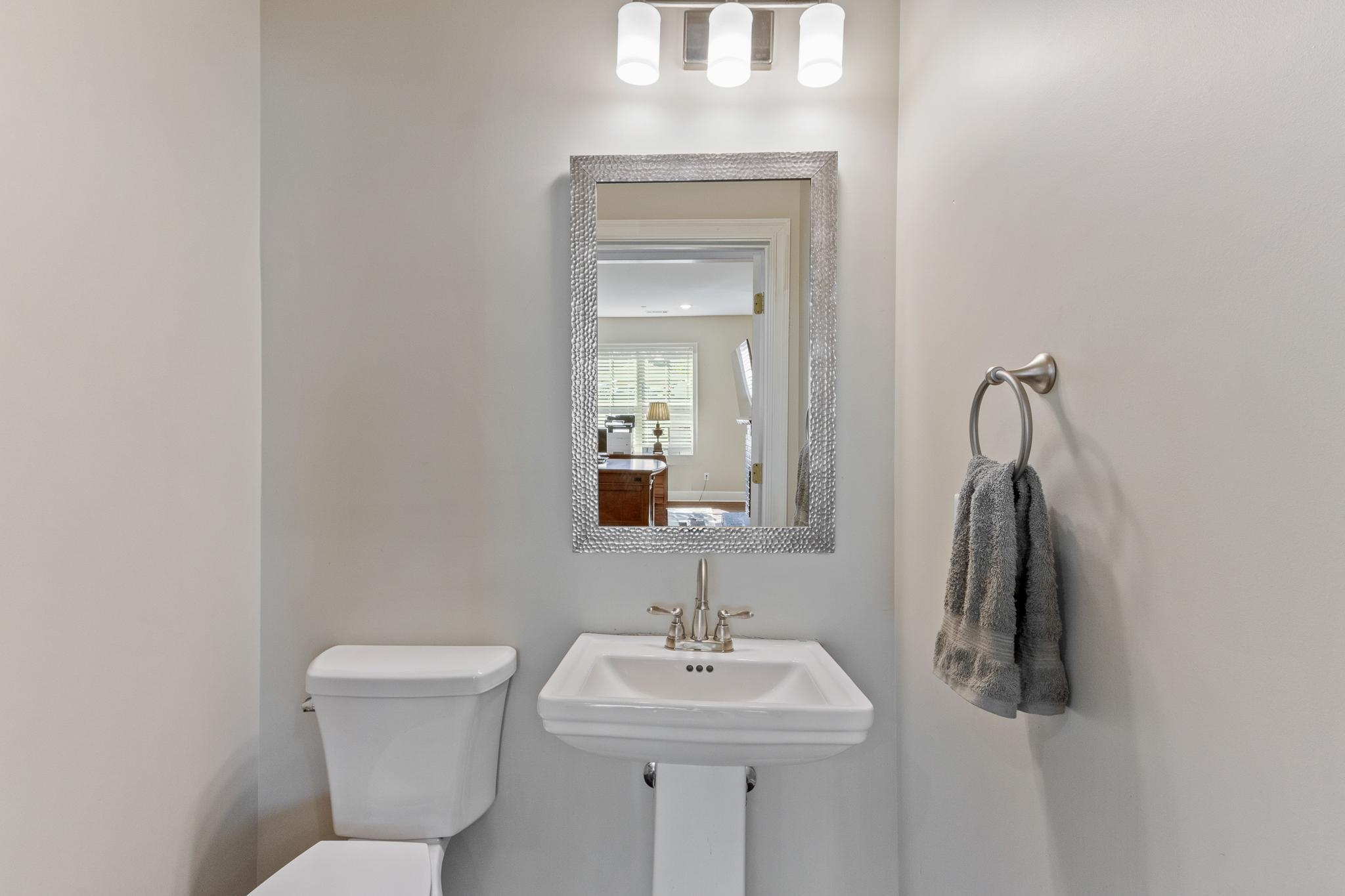 4775 Macon Road Memphis, TN 38122 - Photo 14 of 31 a bathroom with a sink toilet and mirror