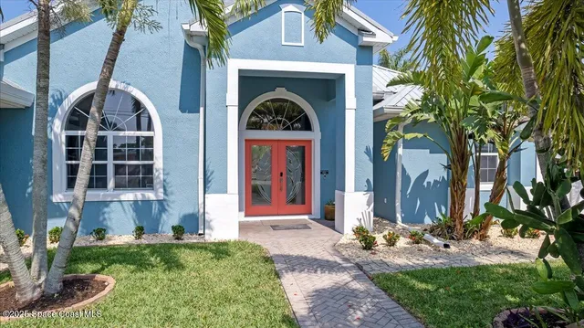a front view of a house with yard