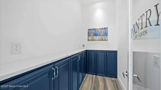 a view of an entryway with wooden floor