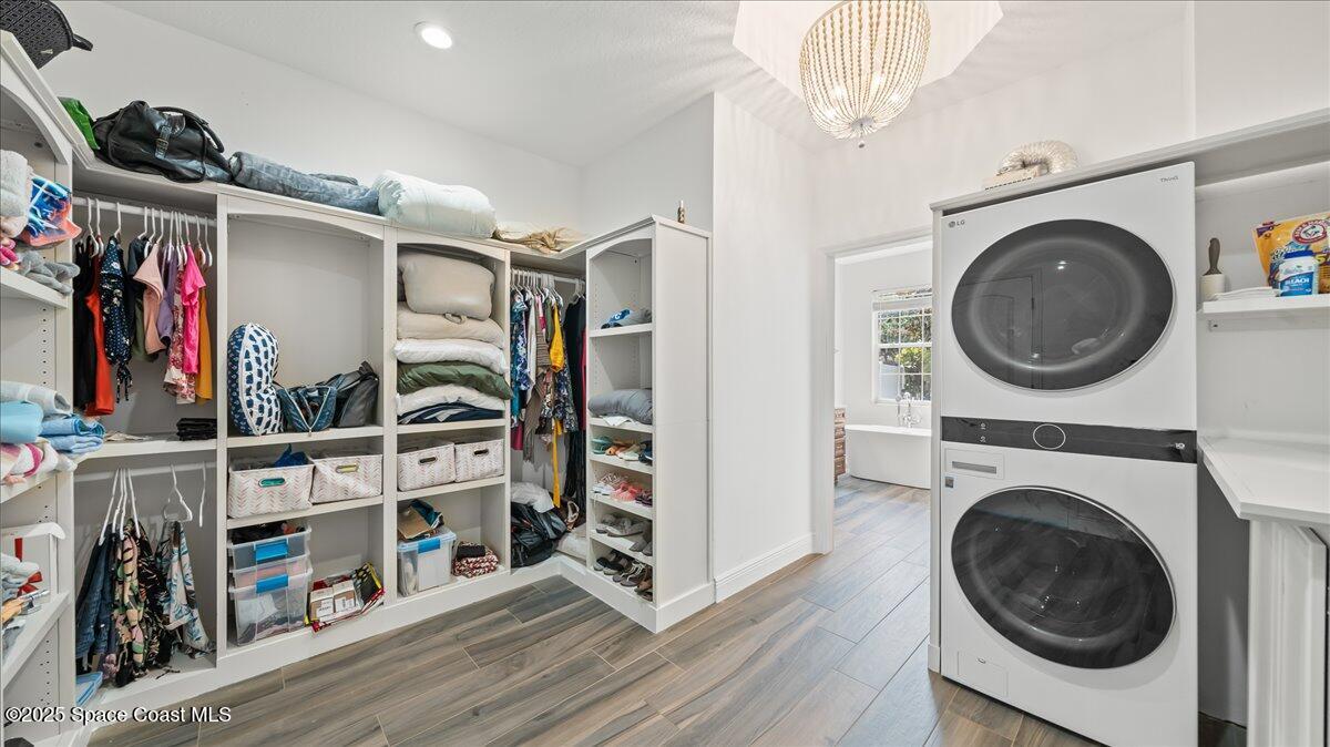 121 Boca Ciega Road Cocoa Beach, FL 32931 - Photo 25 of 50 a view of a storage & utility room with washer and dryer