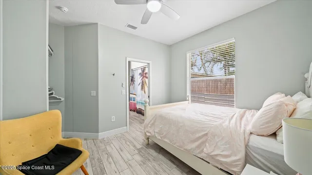 a bedroom with a bed and a couch