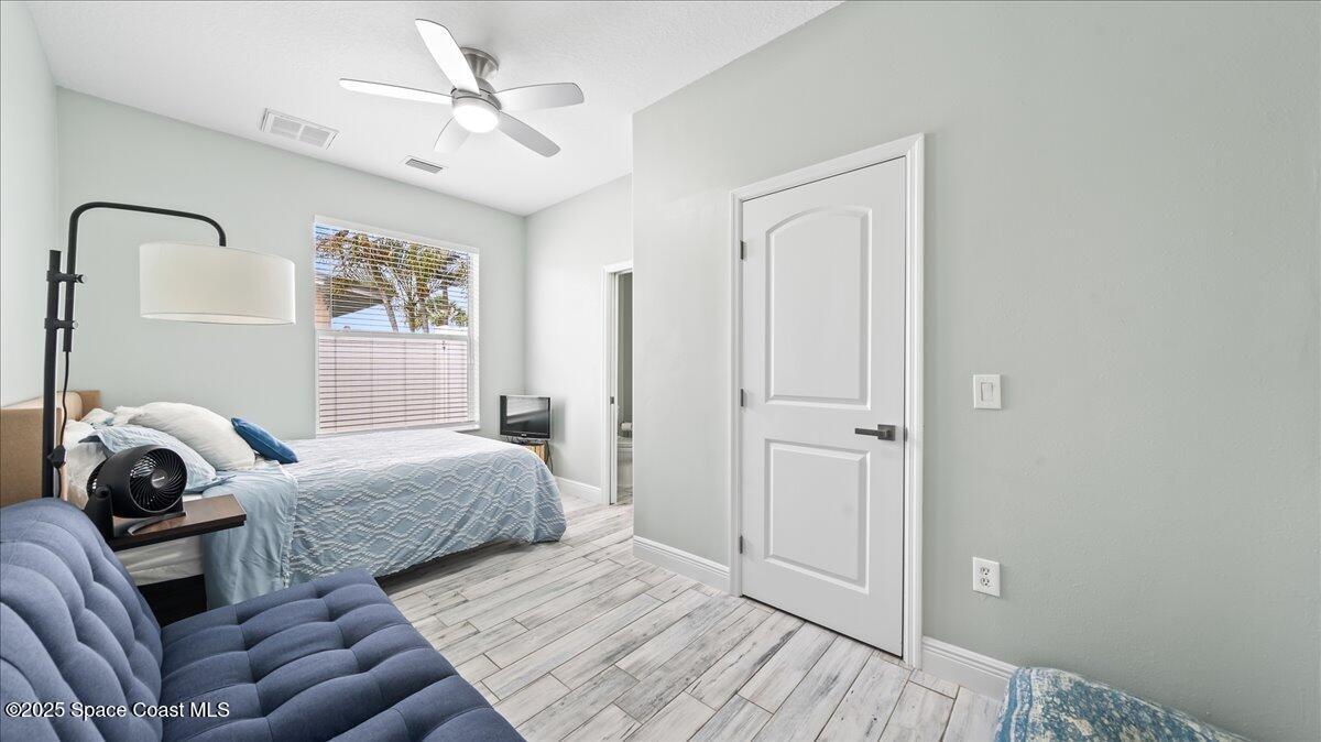 121 Boca Ciega Road Cocoa Beach, FL 32931 - Photo 31 of 50 a bedroom with bed and a window