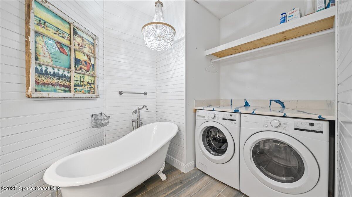 121 Boca Ciega Road Cocoa Beach, FL 32931 - Photo 32 of 50 a bathroom with a toilet a sink and a bathtub