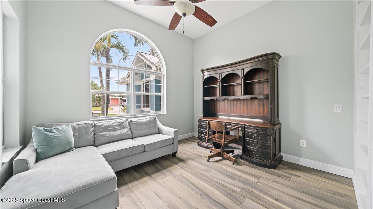 121 Boca Ciega Road Cocoa Beach, FL 32931 - Photo 34 of 50 a living room with furniture and a window