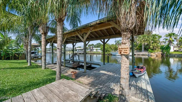a view of a backyard with sitting area
