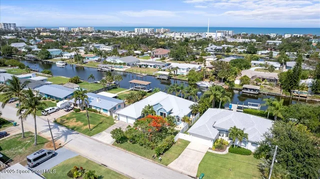 an aerial view of a house with a lake view