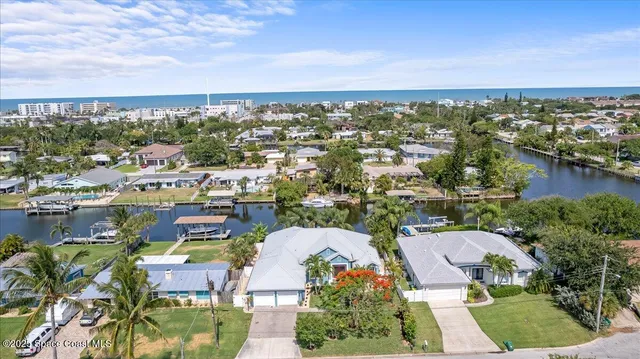 an aerial view of residential houses with outdoor space
