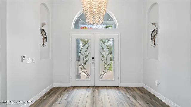 a view of front door with wooden floor