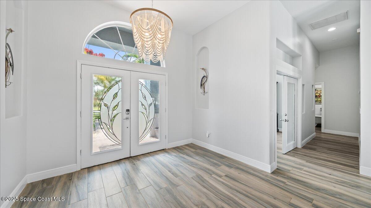 121 Boca Ciega Road Cocoa Beach, FL 32931 - Photo 8 of 50 a view of a livingroom with wooden floor