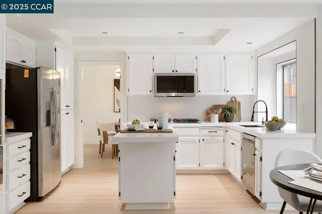 a kitchen with a sink stove and refrigerator